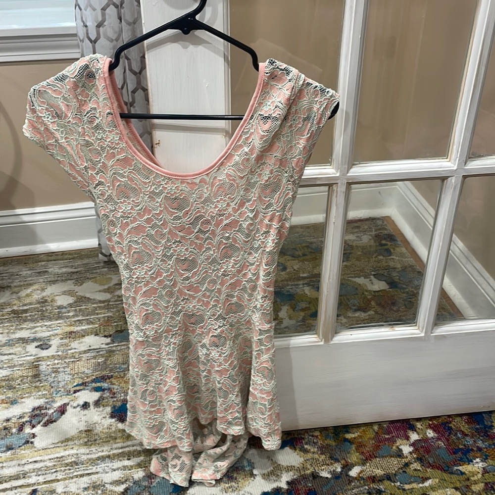 Pink mesh shirt that had a partial open back